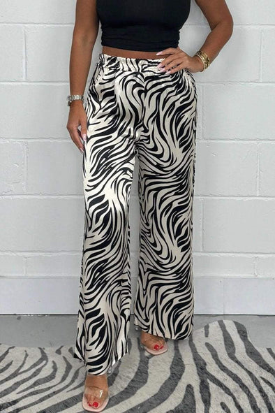 Women's Shiny animal print trousers